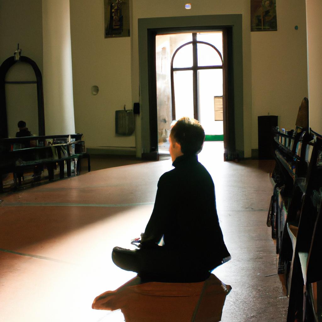 Person meditating in a church